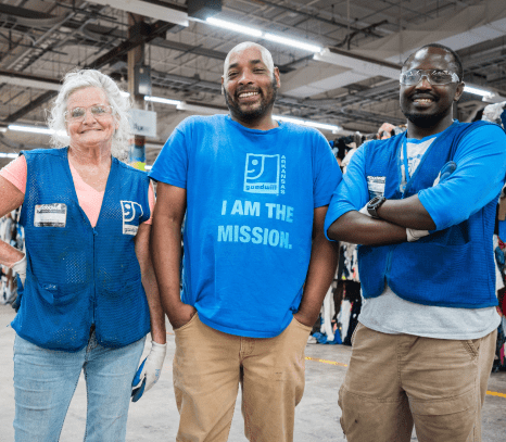 Warehouse workers posing with safety glasses