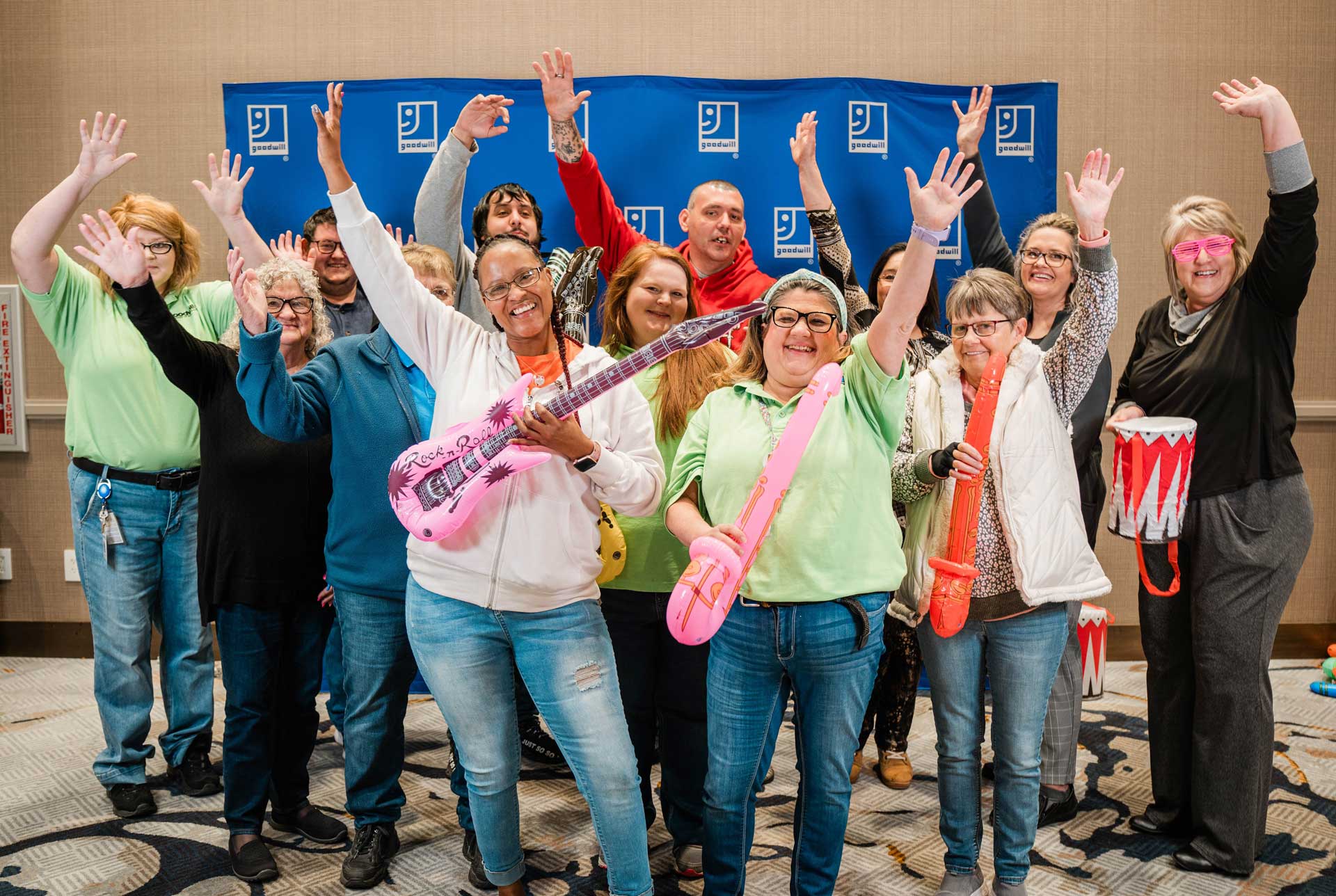 Goodwill team waving